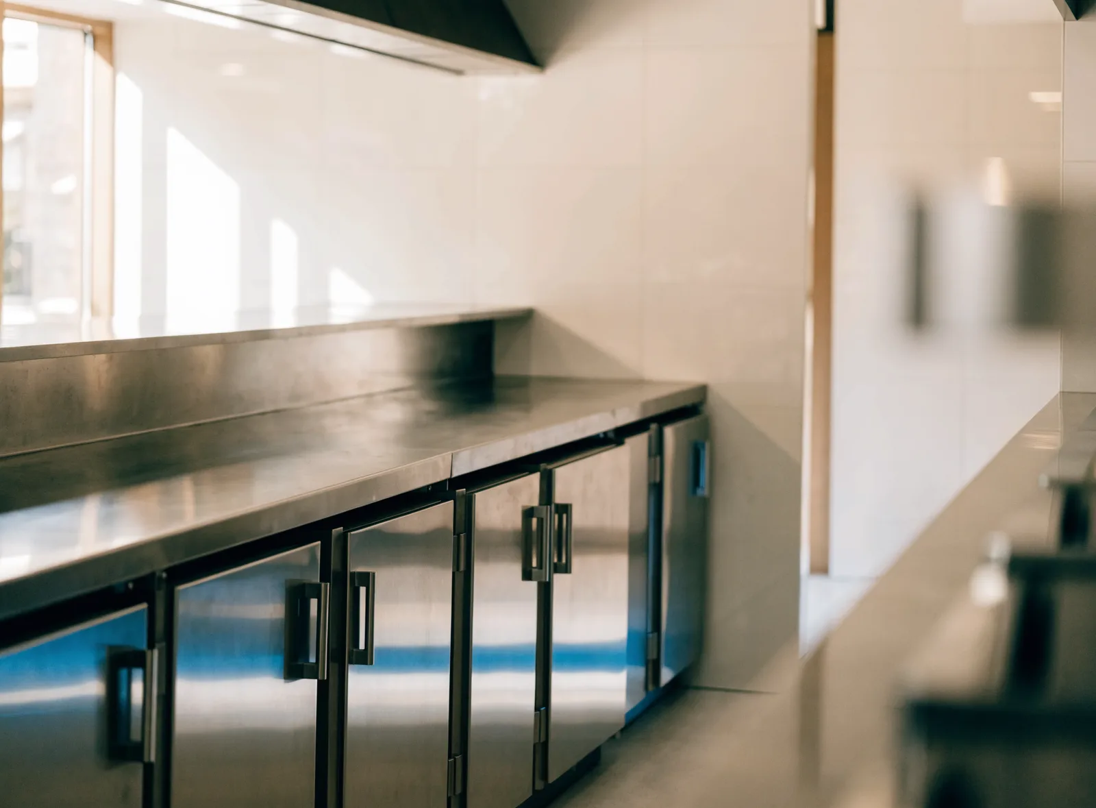Stainless undercounter refrigeration beneath a prep counter